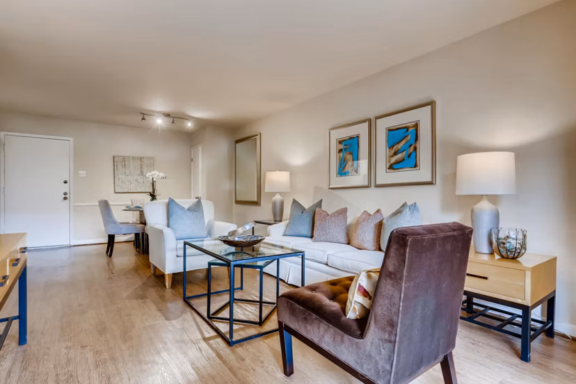 Spacious living room with modern furnishings in The Creole on Yorktown Apartments
