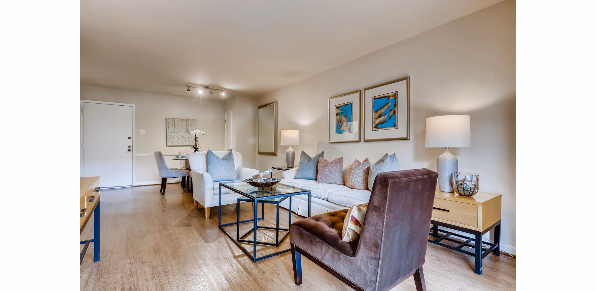Spacious living room with modern furnishings in The Creole on Yorktown Apartments