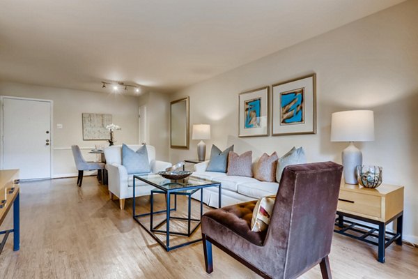 Spacious living room with modern furnishings in The Creole on Yorktown Apartments
