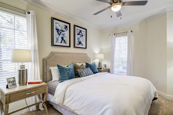 Spacious bedroom with elegant furnishings at The Park at Armand Bayou Apartments