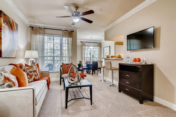 Spacious living room with modern decor at The Park at Armand Bayou Apartments