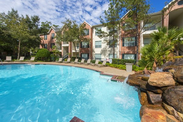 Resort-style pool at The Park at Armand Bayou Apartments offering luxury amenities in a serene environment