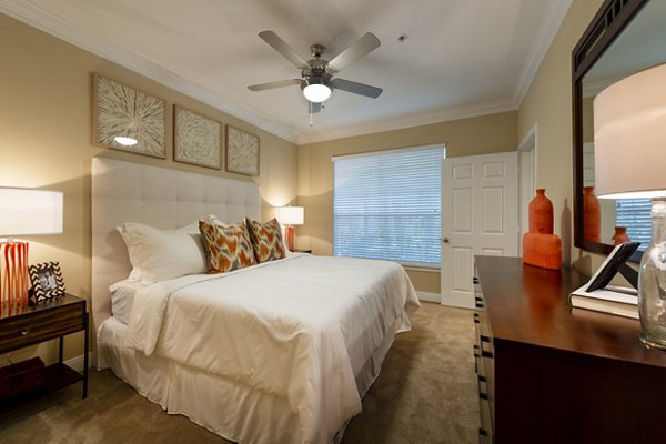 Cozy bedroom with contemporary decor in The Park on Memorial Apartments