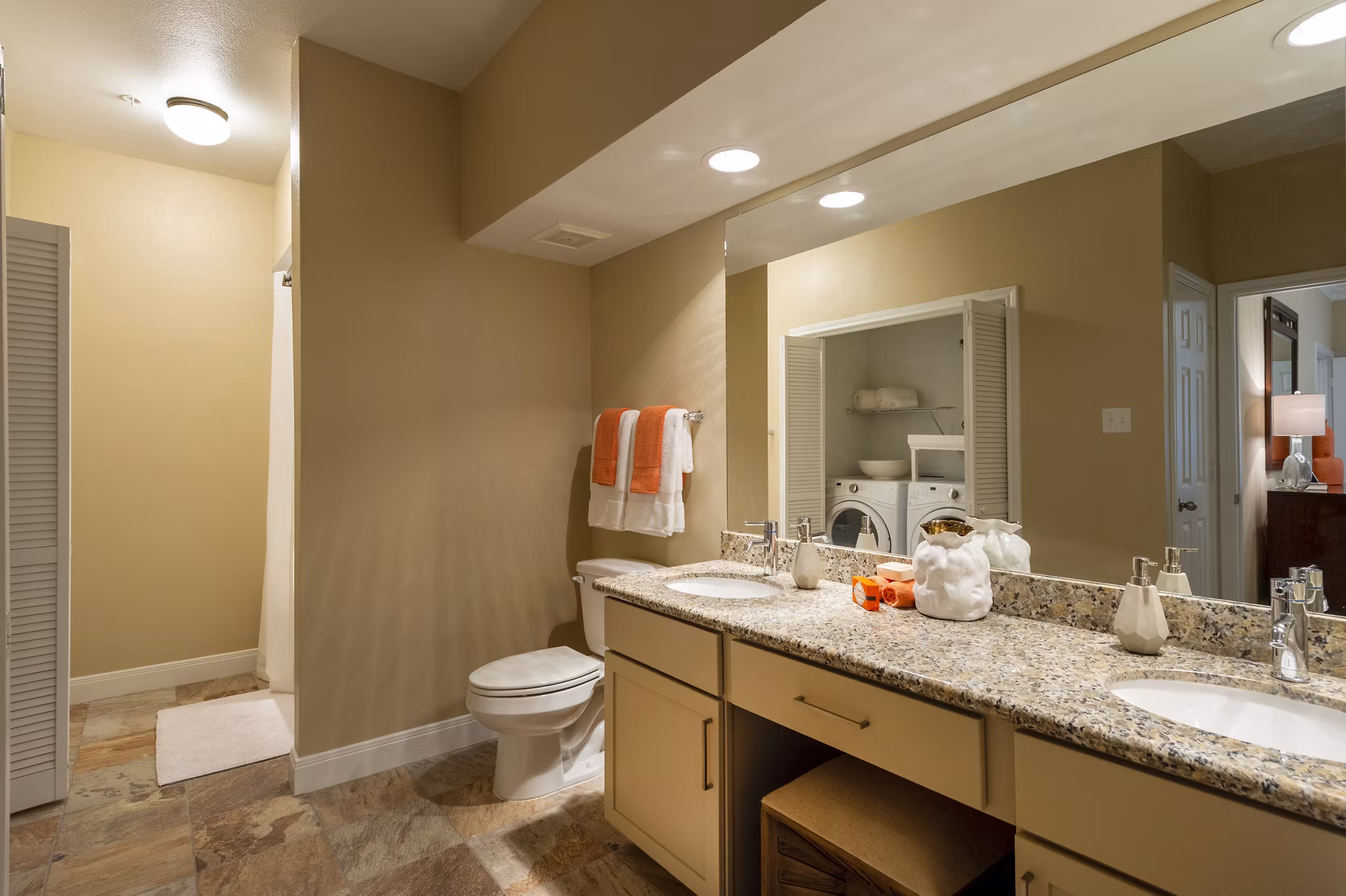 Luxurious bathroom with marble countertops and modern fixtures at The Park on Memorial Apartments