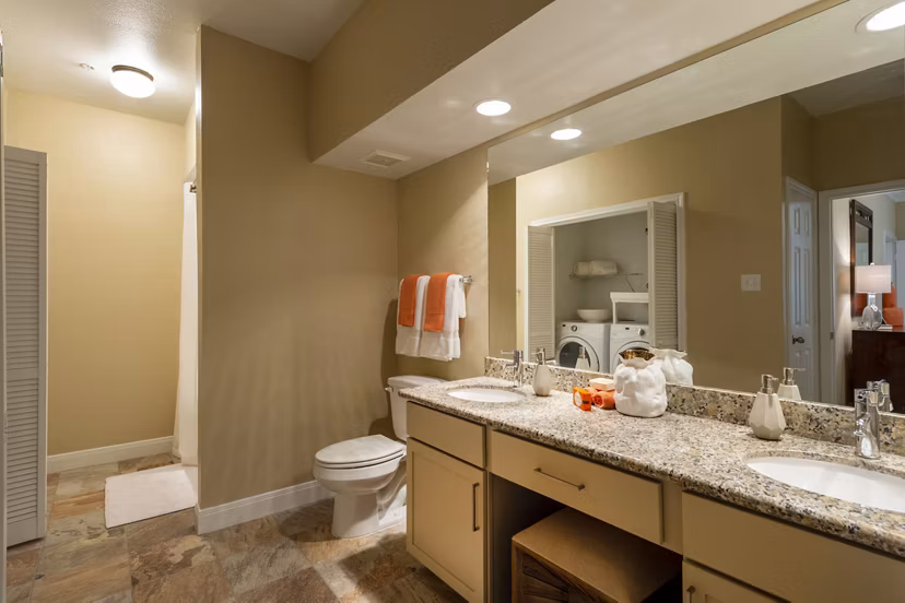 Luxurious bathroom with marble countertops and modern fixtures at The Park on Memorial Apartments