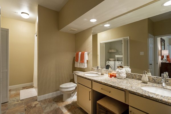 Luxurious bathroom with marble countertops and modern fixtures at The Park on Memorial Apartments