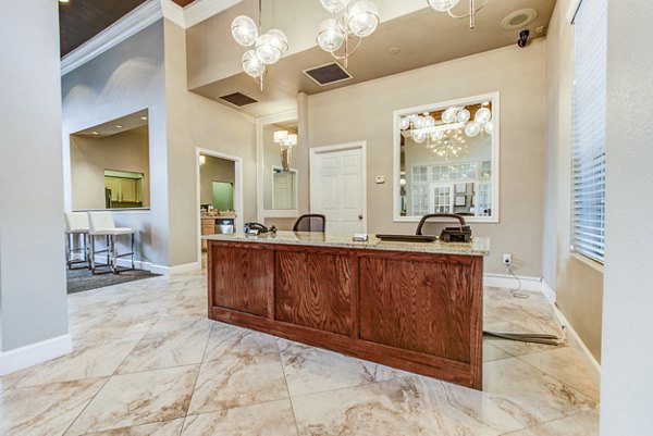Community lounge with modern furnishings at The Park on Memorial Apartments clubhouse