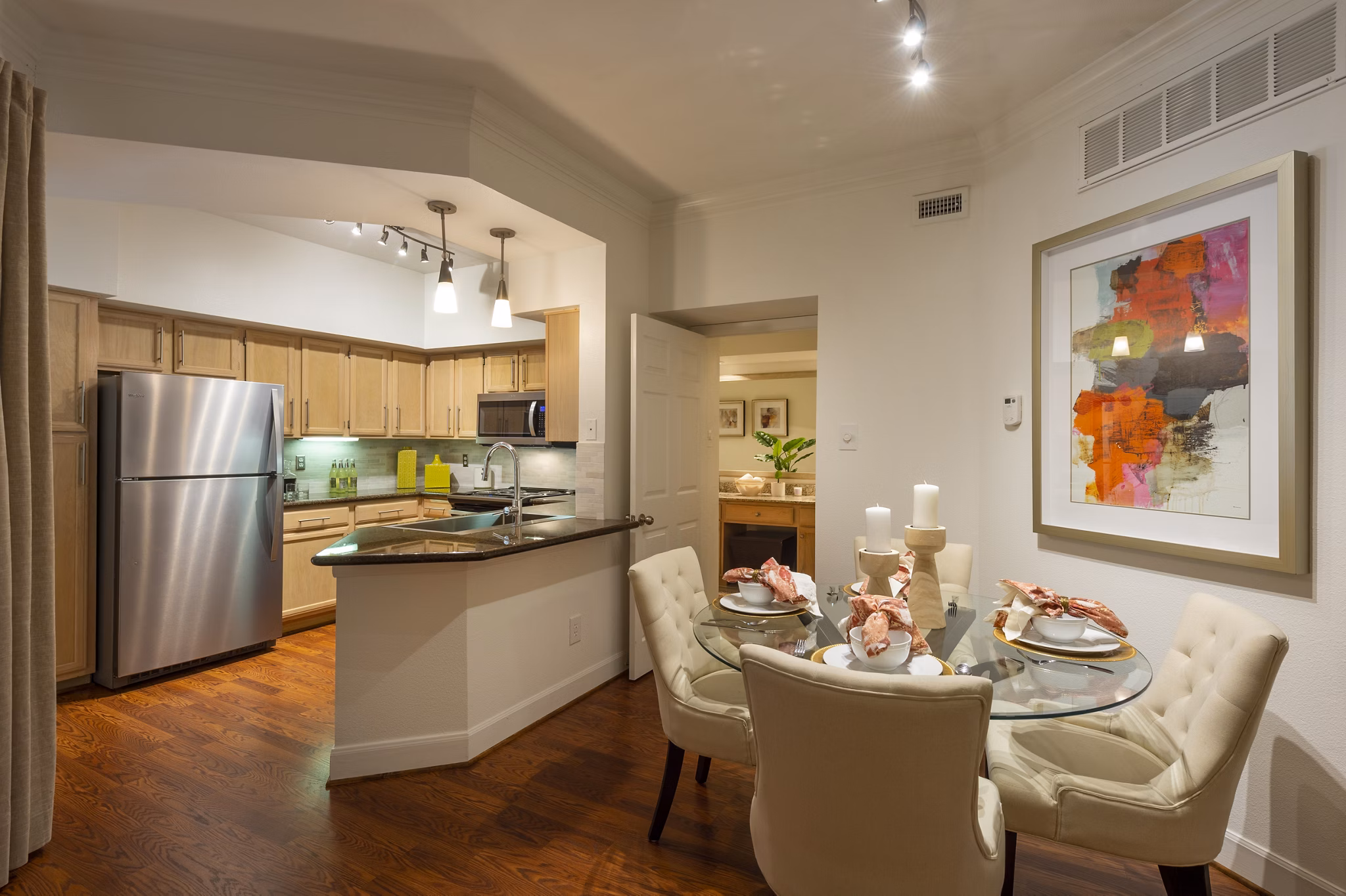 Modern dining area with stylish lighting and seating at The Park on Memorial Apartments