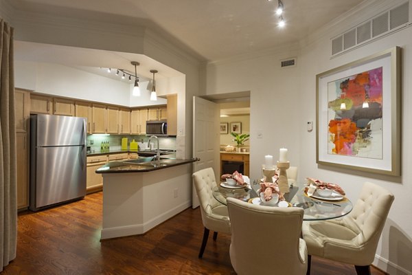 Modern dining area with stylish lighting and seating at The Park on Memorial Apartments