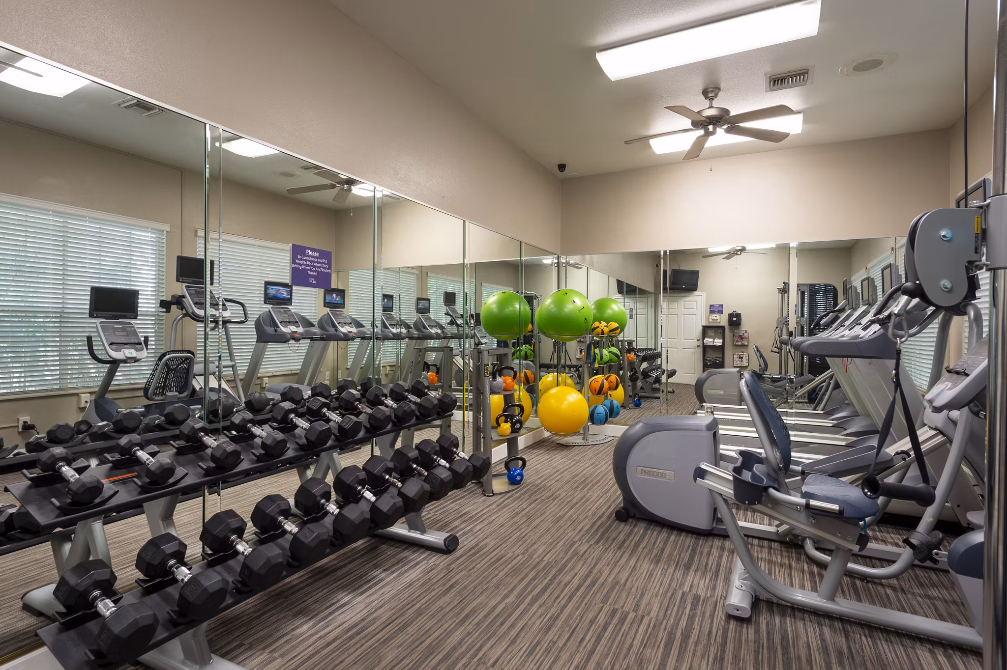 Fitness center with modern gym equipment at The Park on Memorial Apartments