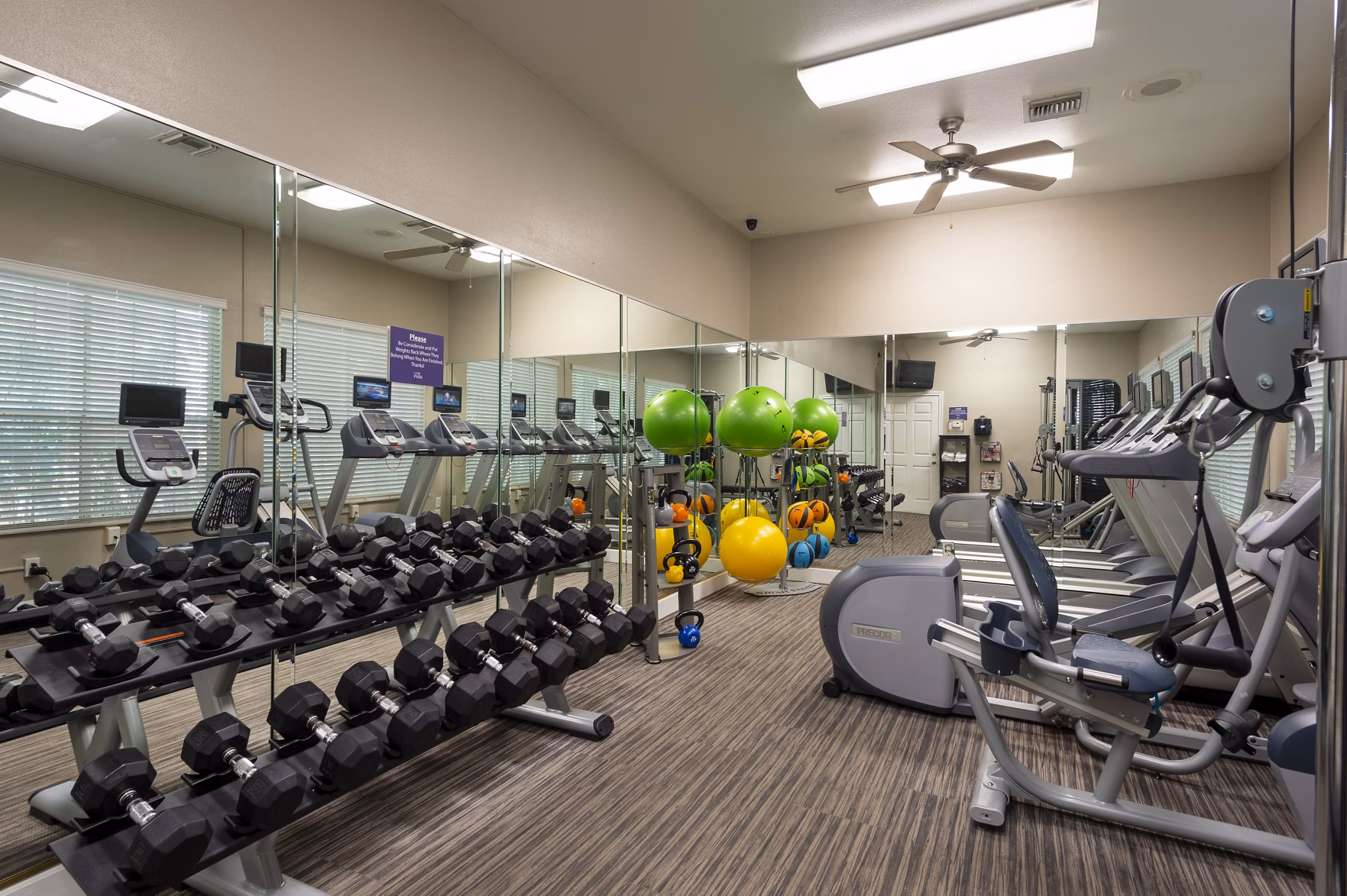 Fitness center with modern gym equipment at The Park on Memorial Apartments