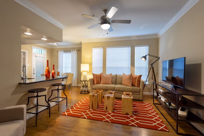 Spacious living room with modern decor in The Park on Memorial Apartments