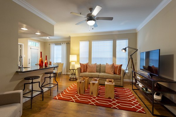Spacious living room with modern decor in The Park on Memorial Apartments