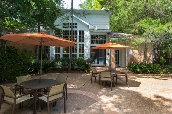 Outdoor patio with modern seating at The Park on Memorial Apartments, ideal for relaxation and socializing in a vibrant community setting