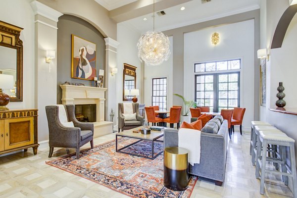 Clubhouse featuring modern design and comfortable seating at Park at River Oaks Apartments