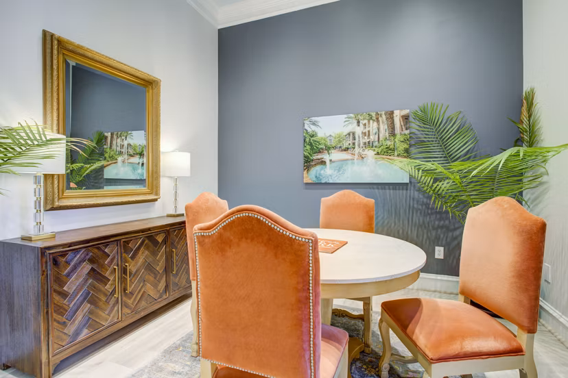 Modern clubhouse with cozy seating and fireplace at Park at River Oaks Apartments