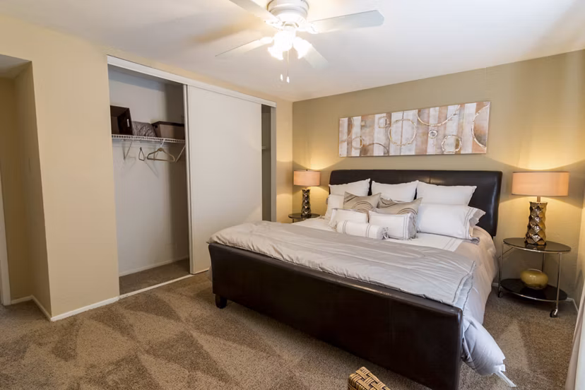 Cozy bedroom with modern decor at The Pines of Woodforest Apartments