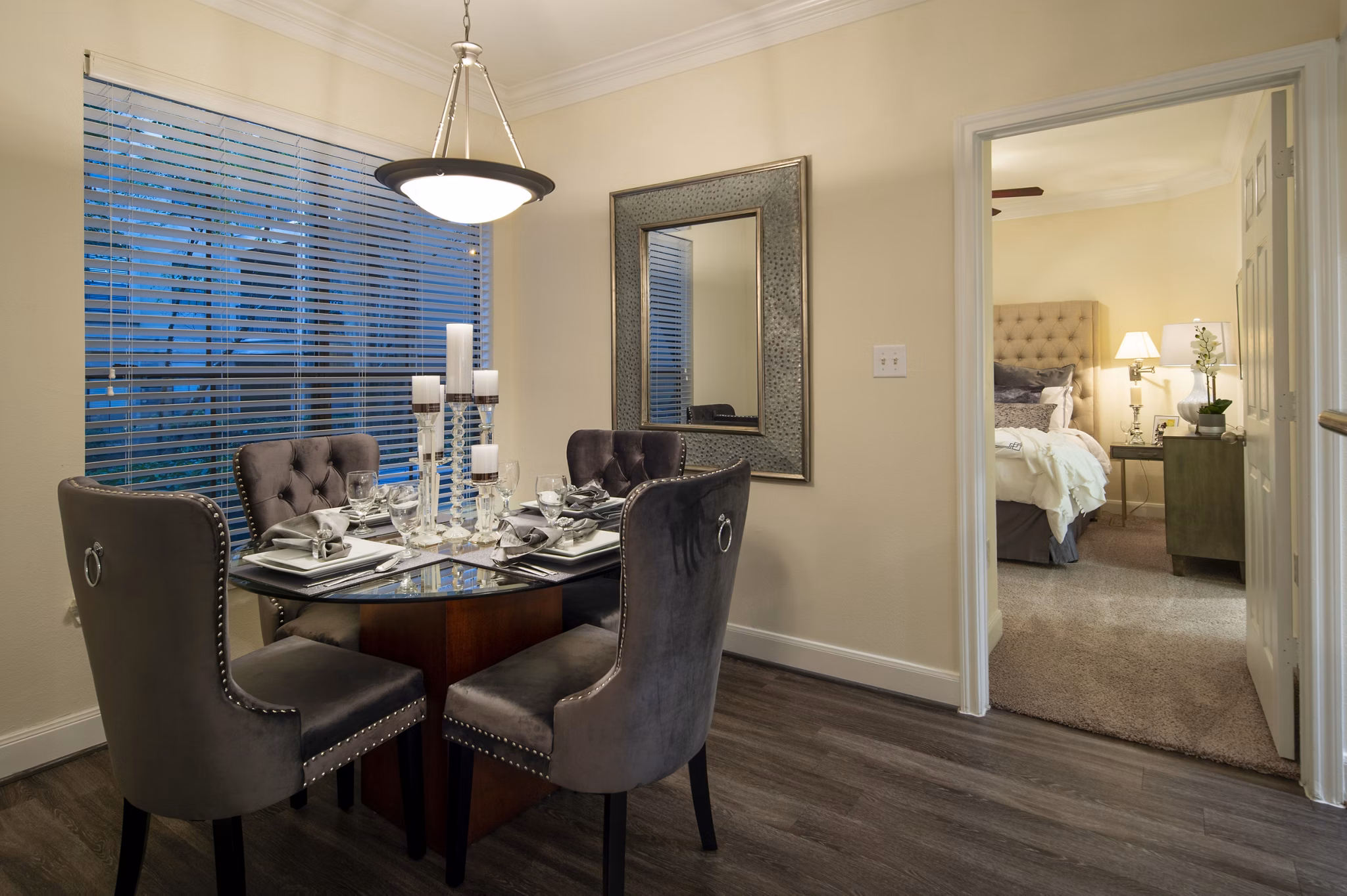 Dining area featuring modern furnishings and elegant lighting at The Post Oak at Woodway Apartments