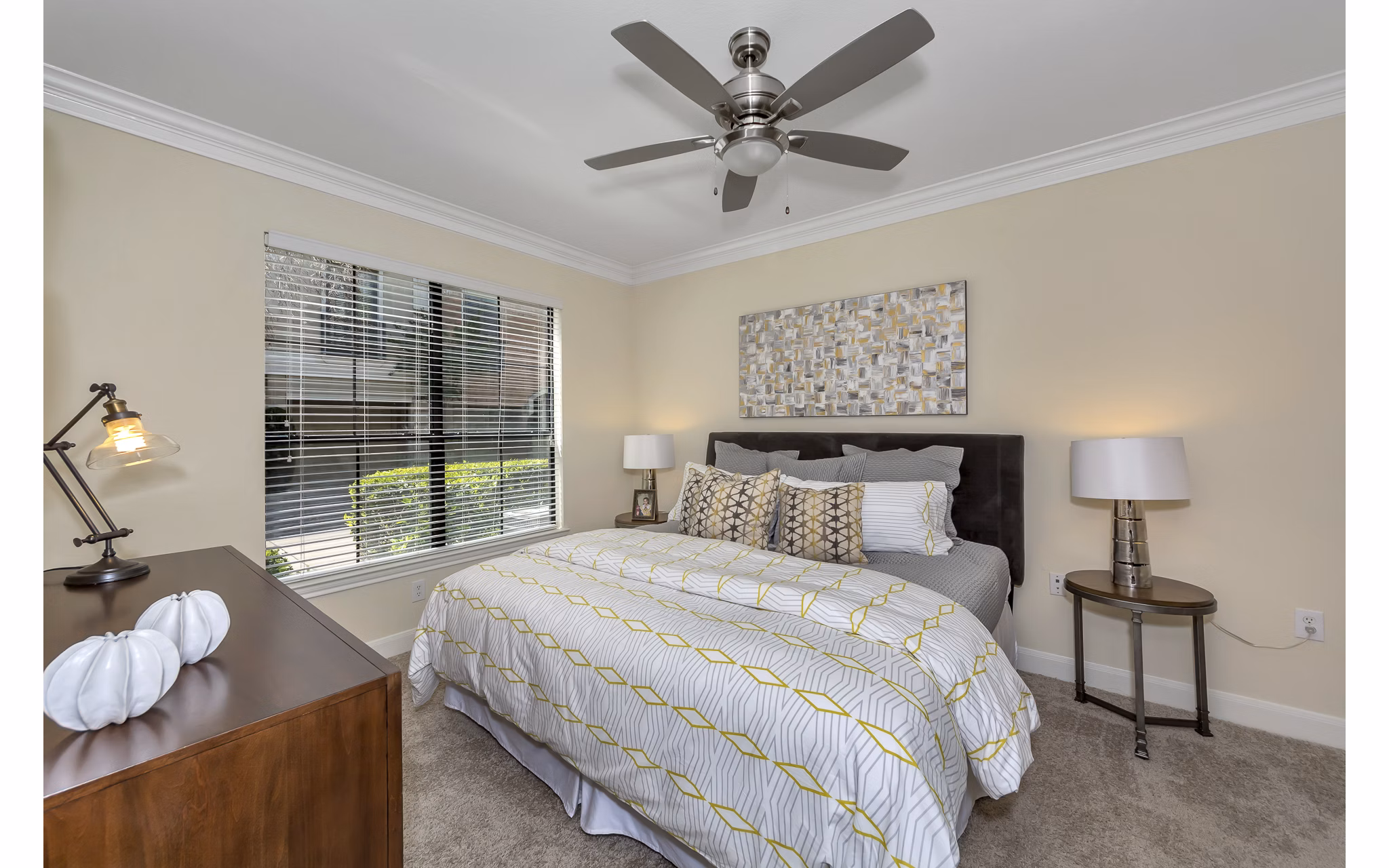 Bedroom featuring elegant decor and plush bedding at Renaissance at Preston Hollow Apartments