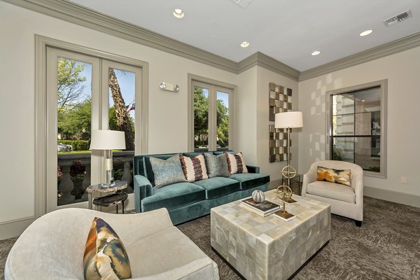 Clubhouse with elegant furnishings and ample seating at Renaissance at Preston Hollow Apartments, offering a luxurious social space