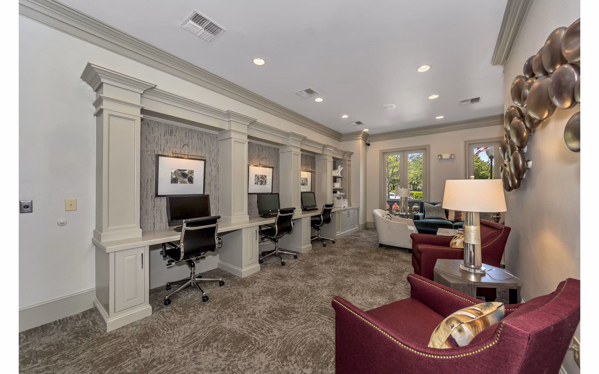 Business center with modern desks and computers at Renaissance at Preston Hollow Apartments, luxury living spaces in Dallas