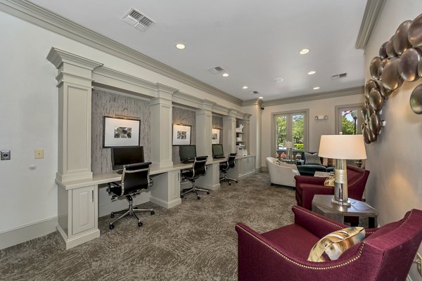 Business center with modern desks and computers at Renaissance at Preston Hollow Apartments, luxury living spaces in Dallas