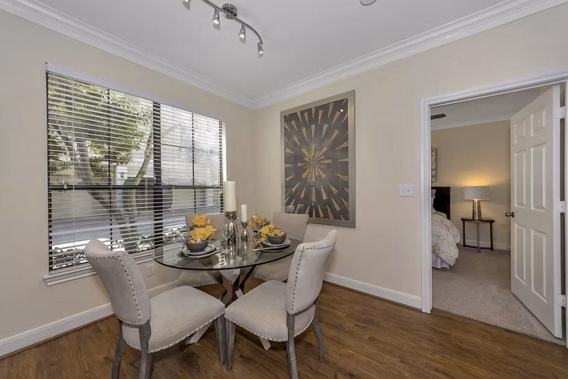 Elegant dining area with modern decor features at Renaissance at Preston Hollow Apartments, ideal for luxurious living experiences