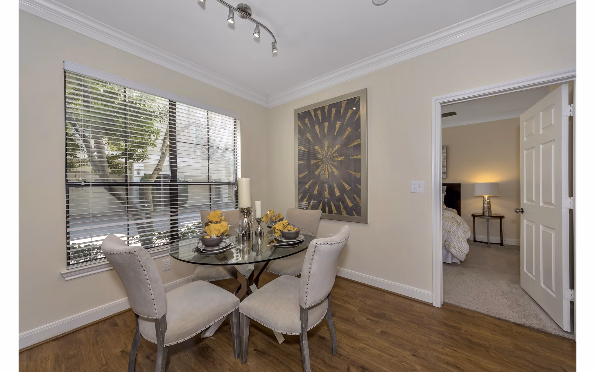 Elegant dining area with modern decor features at Renaissance at Preston Hollow Apartments, ideal for luxurious living experiences