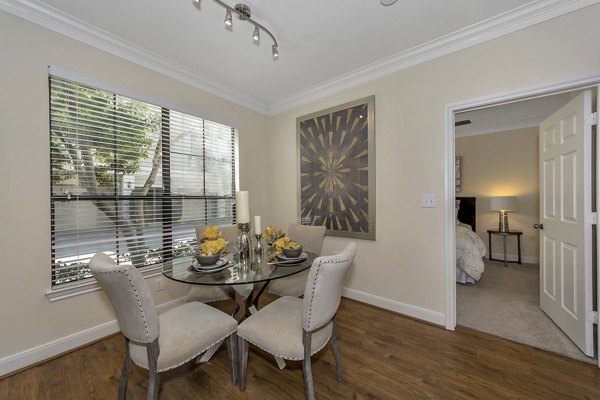 Elegant dining area with modern decor features at Renaissance at Preston Hollow Apartments, ideal for luxurious living experiences