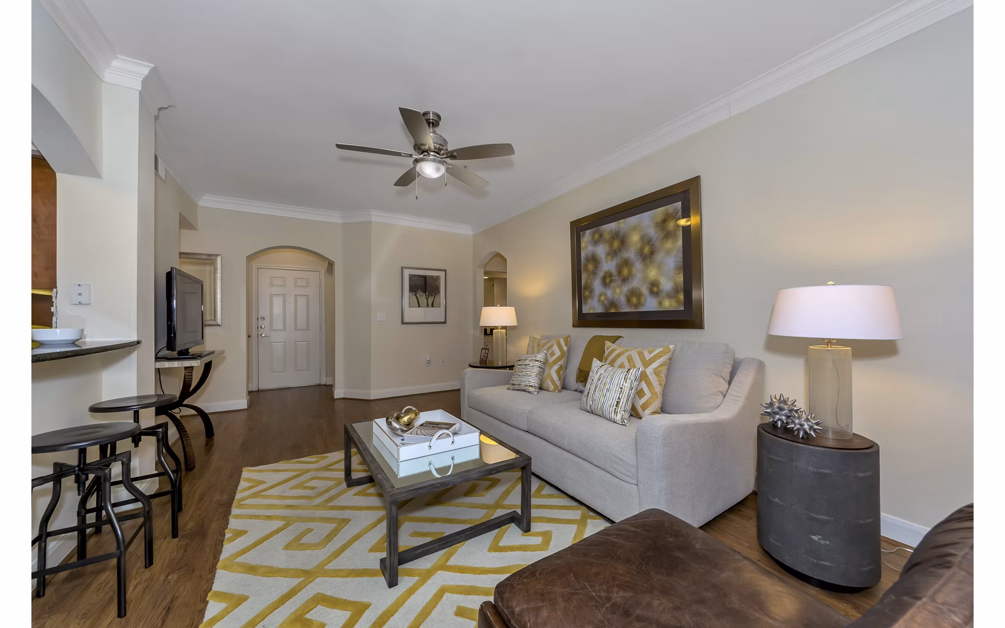 Living room featuring modern decor and large windows in Renaissance at Preston Hollow Apartments