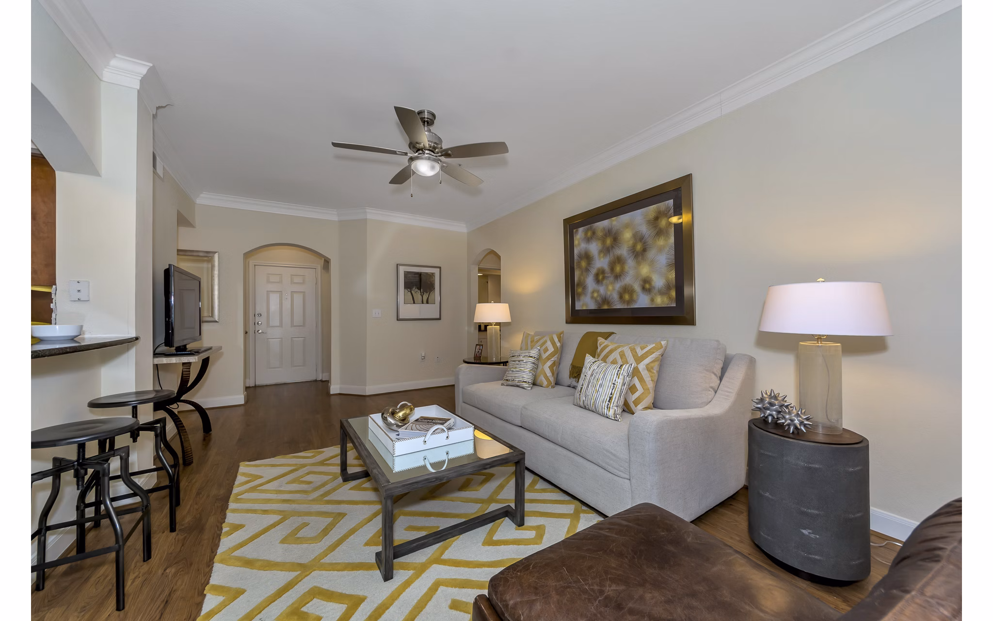 Living room featuring modern decor and large windows in Renaissance at Preston Hollow Apartments