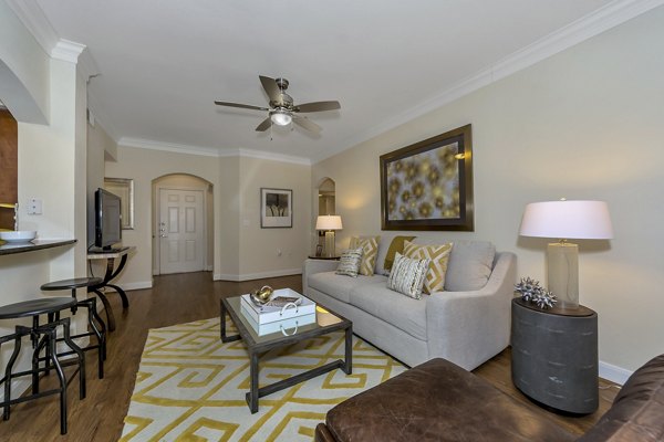 Living room featuring modern decor and large windows in Renaissance at Preston Hollow Apartments