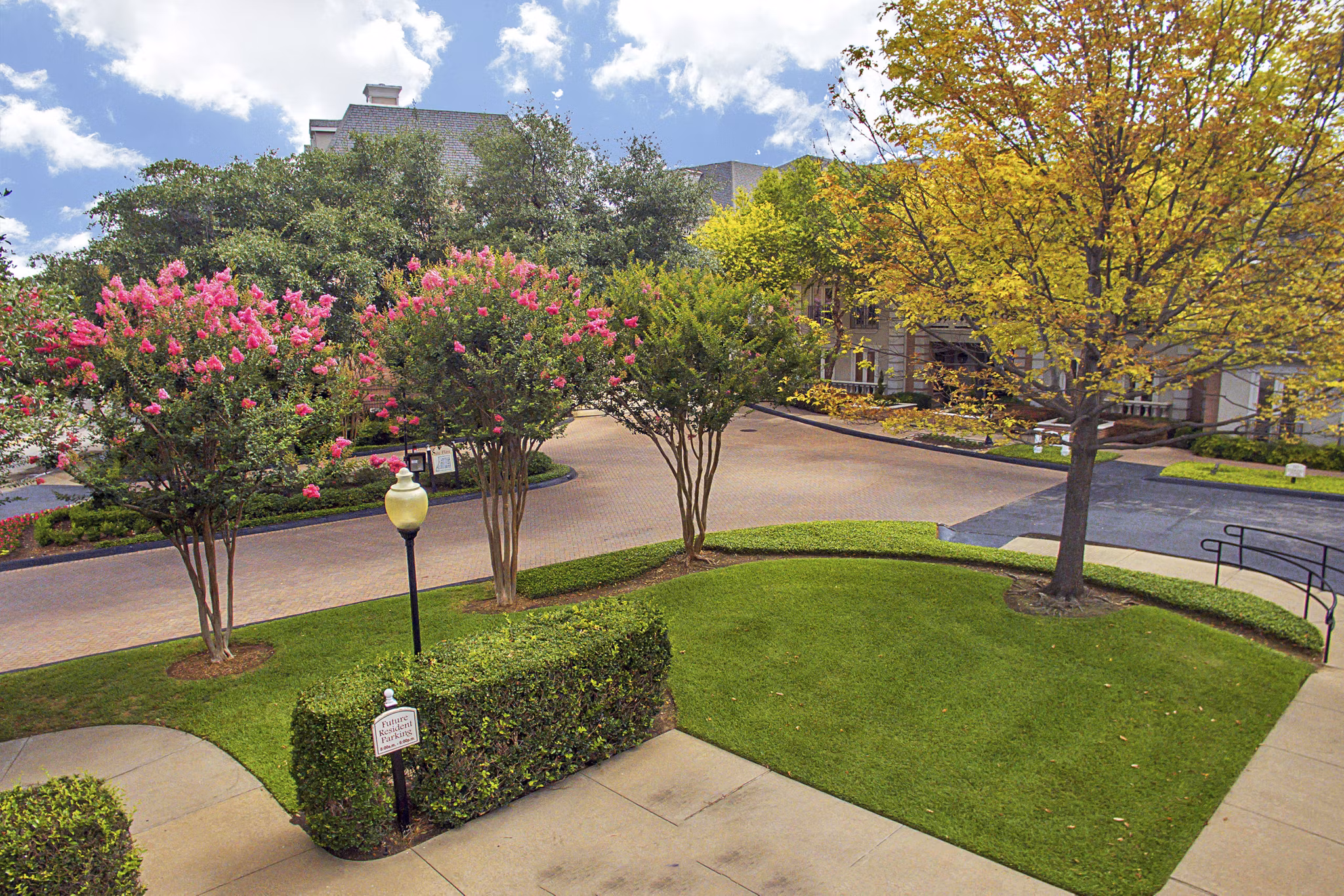 Exterior view of Renaissance at Preston Hollow Apartments in North Dallas, featuring luxury architectural design and landscaped surroundings