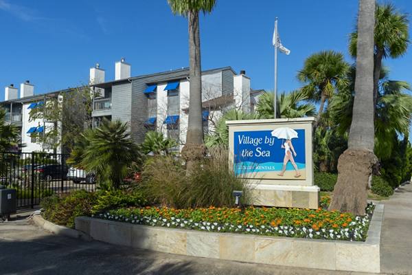 signage at Village by the Sea Apartments