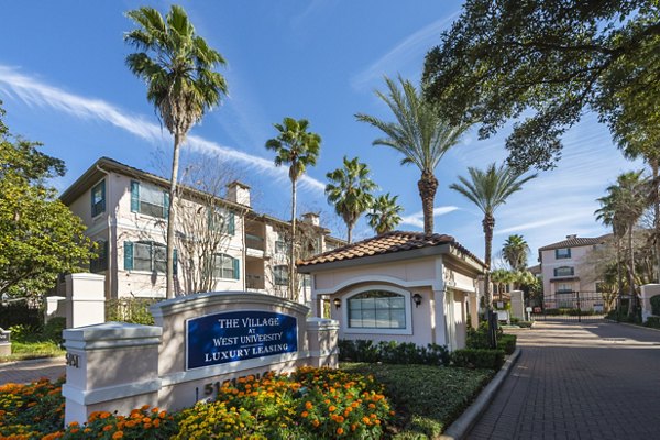The Village at West University Apartments: Modern signage at luxury community entrance