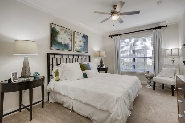 Cozy bedroom with stylish decor at The Village at West University Apartments