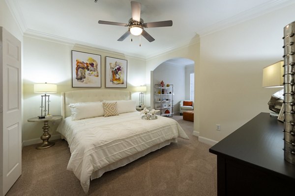 Spacious bedroom with modern decor in The Village at West University Apartments, Houston
