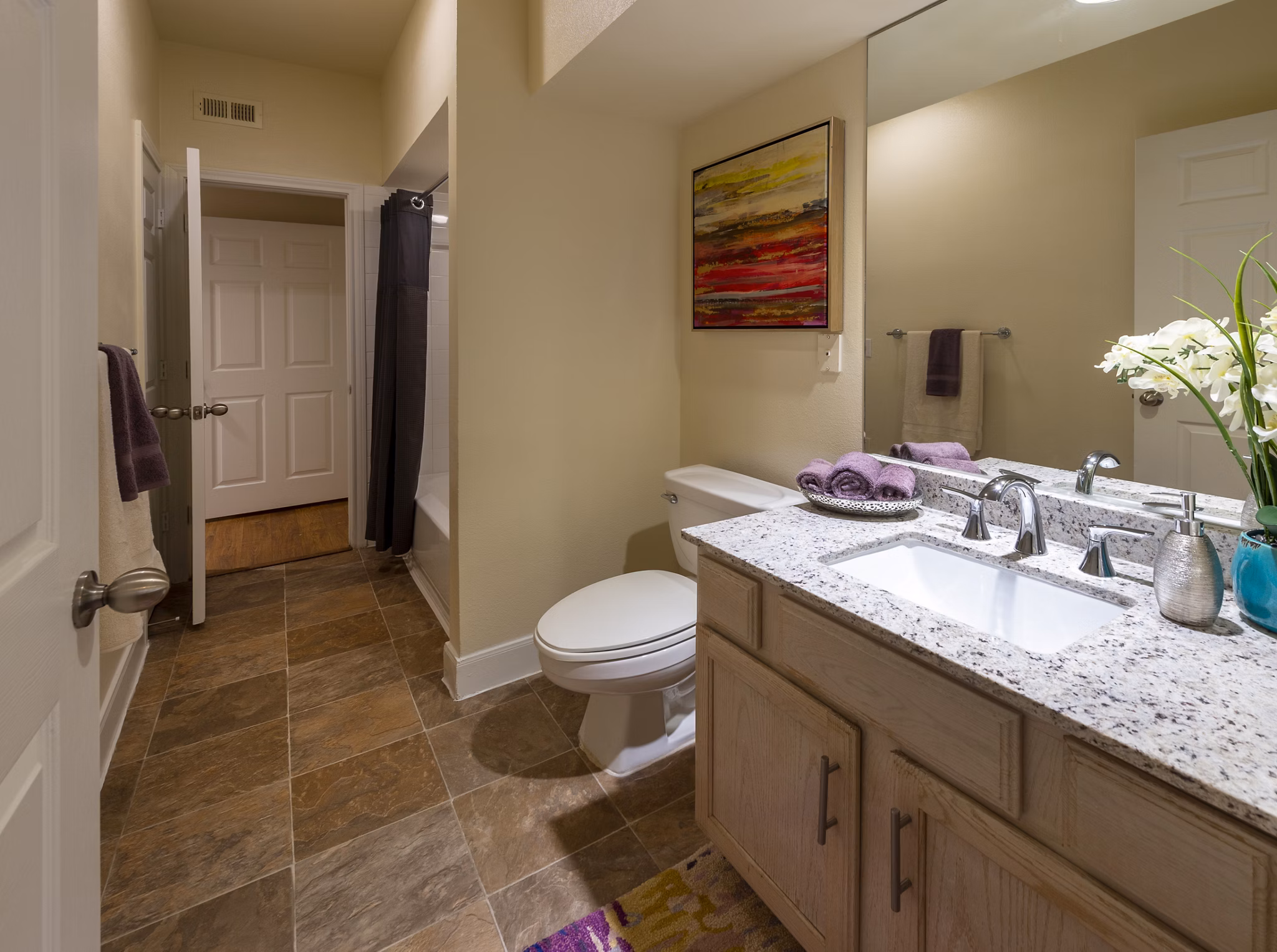 Modern bathroom with sleek fixtures in The Village at West University Apartments