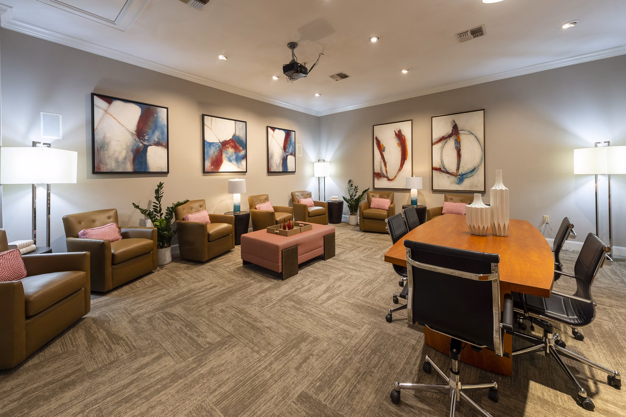 Clubhouse featuring modern design and open seating at The Village at West University Apartments