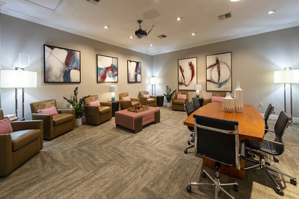 Clubhouse featuring modern design and open seating at The Village at West University Apartments
