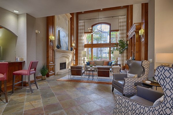 Clubhouse with modern lounge area at The Village at West University Apartments
