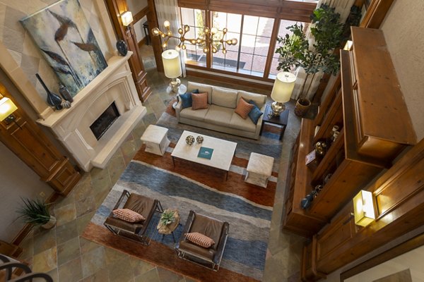 Modern clubhouse featuring comfortable seating and entertainment options at The Village at West University Apartments