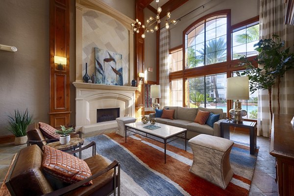 Clubhouse featuring modern design and cozy seating at The Village at West University Apartments, ideal for community gatherings