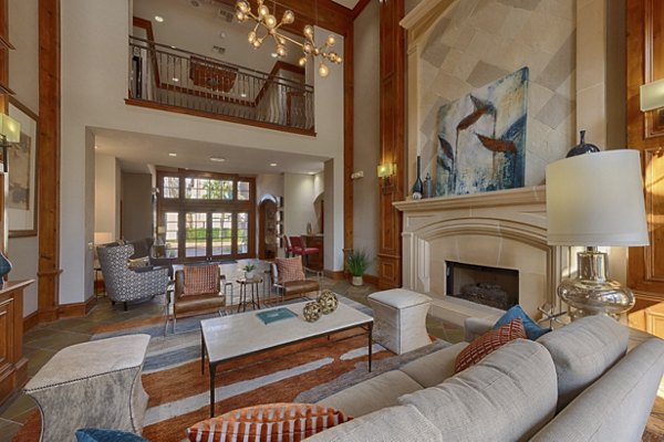 Modern clubhouse featuring lounge areas at The Village at West University Apartments
