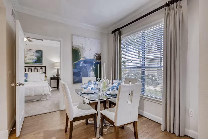 Elegant dining area with modern furnishings at The Village at West University Apartments