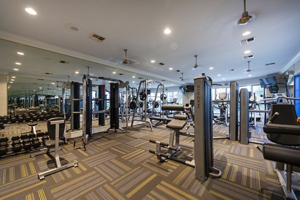 fitness center at The Village at West University Apartments
