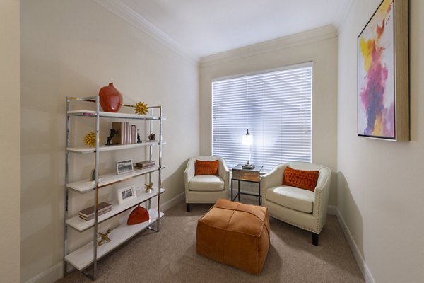 Lounge area with modern decor in The Village at West University Apartments