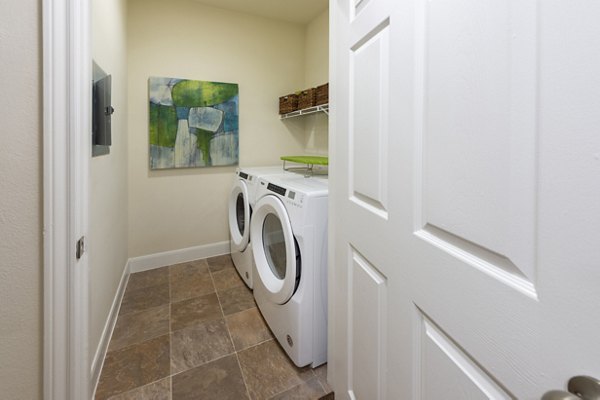 laundry room at The Village at West University Apartments
