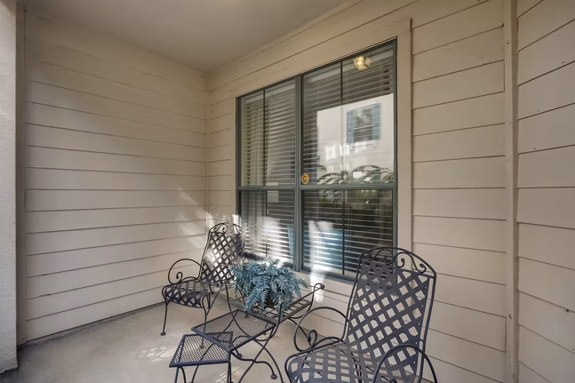 Patio with modern outdoor seating at The Village at West University Apartments