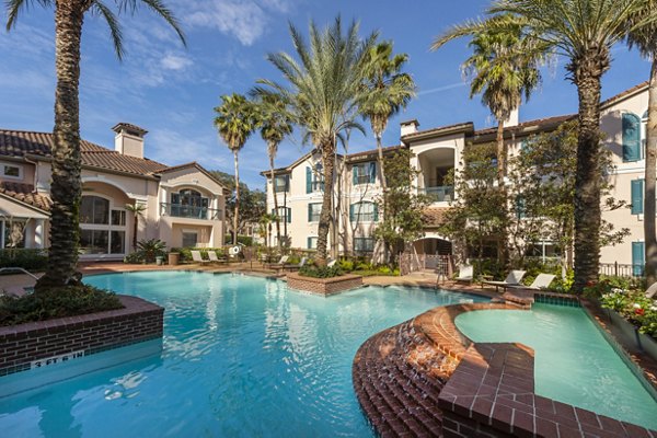 Refreshing outdoor pool at The Village at West University Apartments offering relaxation and leisure options for residents